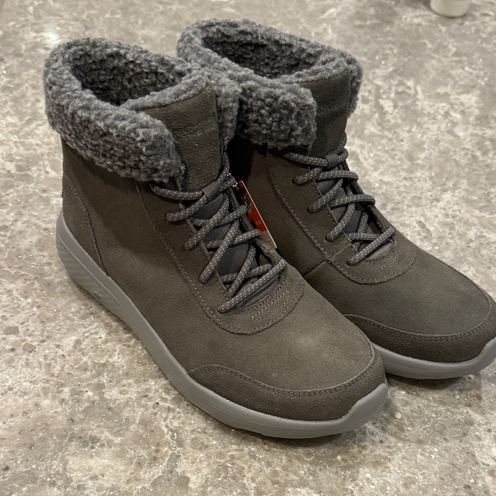 New, never worn Skechers faux fur lined boots.